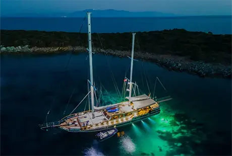 dea del mare yacht anchored in bay evening view