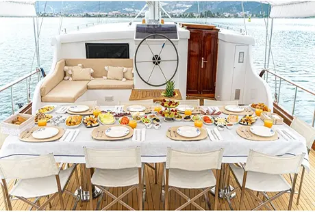 gulet boat happy days aft deck dining table with wheelhouse 